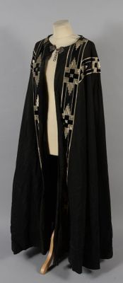 an image of a black and gold cape with a star design on it