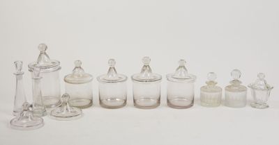 a lot of glass bottles and jars on the table
