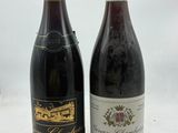 deux bouteilles de vin posées l'une à côté de l'autre sur une table