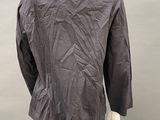 the back view of a mannequin wearing a gray shirt and pants
