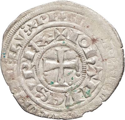 a close up of a coin with a cross on it