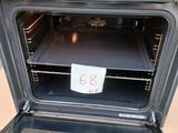 an open oven with a note in it on the door