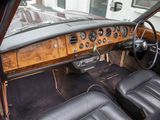 a dashboard of a car with leather seats and a steering wheel