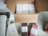 a cardboard box filled with different types of paper