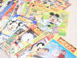 a lot of cartoon books on the table together