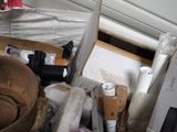 a pile of assorted items in a cluttered room