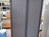 a large metal cabinet in the middle of a warehouse