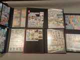 many different types of stamps on the pages of a binder