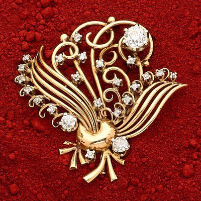 Broche fils en or 18k (750e), stylisant une gerbe, ponctuée …