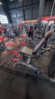 a large gym with a lot of machines in it