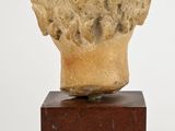 marble head of a woman on a wooden base