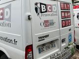 a white van that is parked in a lot