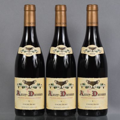 three bottles of wine sitting on top of a table next to each other