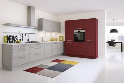 an image of a modern kitchen with white floors and red cabinets