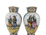 two vases with a painting of a man and a woman on them