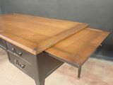 a desk with two drawers on top of it
