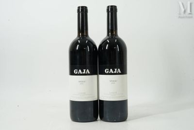 two bottles of wine sitting next to each other on a table