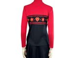 the back of a mannequin wearing a red sweater and black skirt