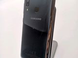 a close up of a cell phone on a stand