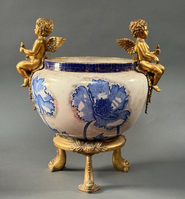 a large vase with angels on it on a stand