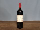 a bottle of wine that is sitting on a table