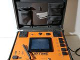 an orange and black case with an electronic device inside of it