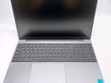 an open laptop computer sitting on top of a white table