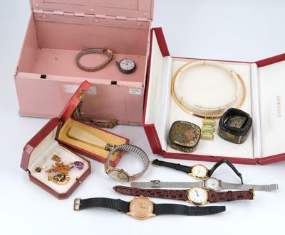 many different types of watches and jewelry in a pink box