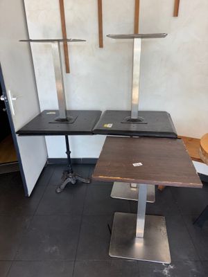 a table with two chairs and a table with a laptop on it