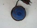 a blue light that is attached to a white wall