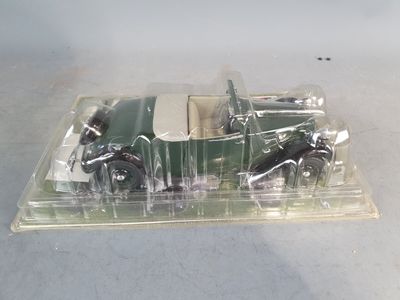 a plastic box with a green car inside of it