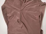 a women ' s brown top with a knot at the neck
