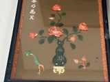 a picture of a picture of flowers in a vase on a table