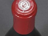 a close up of a bottle of wine on a table