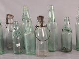 a lot of empty bottles that are sitting on a table