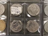 six different types of coins are in a clear plastic case