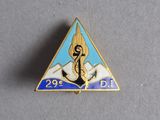 a close up of a triangle shaped pin with a person on it