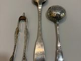 a lot of silver spoons and spoon spoons on a table