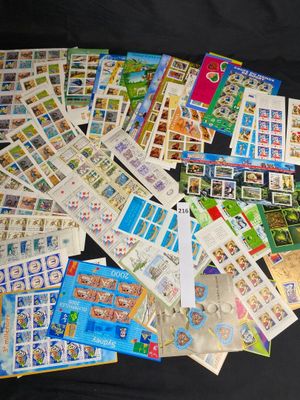 a lot of stamps on a black surface