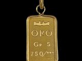 un gros plan d'un lingot d'or sur lequel figure la date