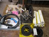 a box of tools sitting on the floor next to a box of wires