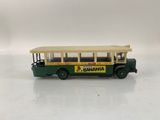 a toy bus that is sitting on a white surface