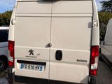 a white van that is parked next to a white van
