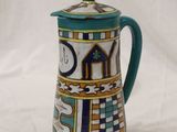 an image of a ceramic coffee pot with a lid