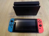 two nintendo switchers sitting next to each other on a table