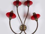 a pair of red glass wall lights on a white background