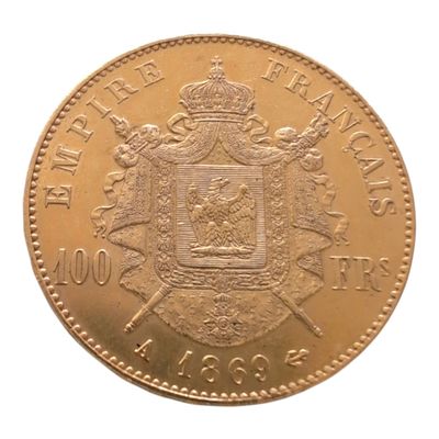gros plan d'une pièce d'or portant des armoiries