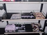 a glass shelf with many different items on it