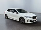 a white bmw m140i sports wagon parked in a white room