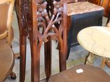many chairs and tables that are in a room